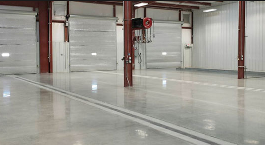 ​Commercial flooring in bright large garage.